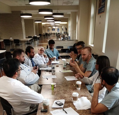 Doctors and residents sitting at a table